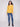 Chic honey knit sweater with convenient side pockets for added functionality by Charlie B.