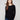 Black knit sweater featuring a stylish boat neck and long ribbed sleeves, perfect for a chic look by Charlie B.