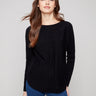 Black knit sweater featuring a stylish boat neck and long ribbed sleeves, perfect for a chic look by Charlie B.
