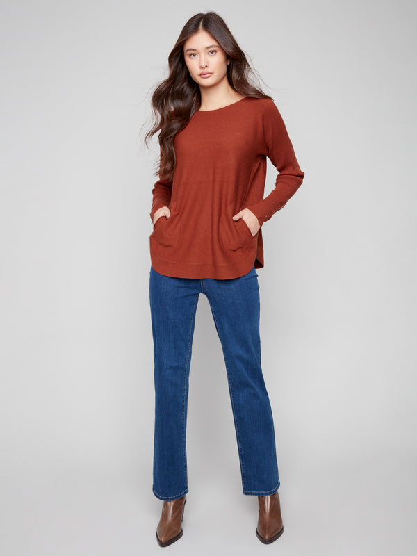 This sepia sweater features a stylish boat neck and long ribbed sleeves by Charlie B.
