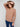 Chic knit sweater showcasing long ribbed sleeves for added warmth and style by Charlie B.