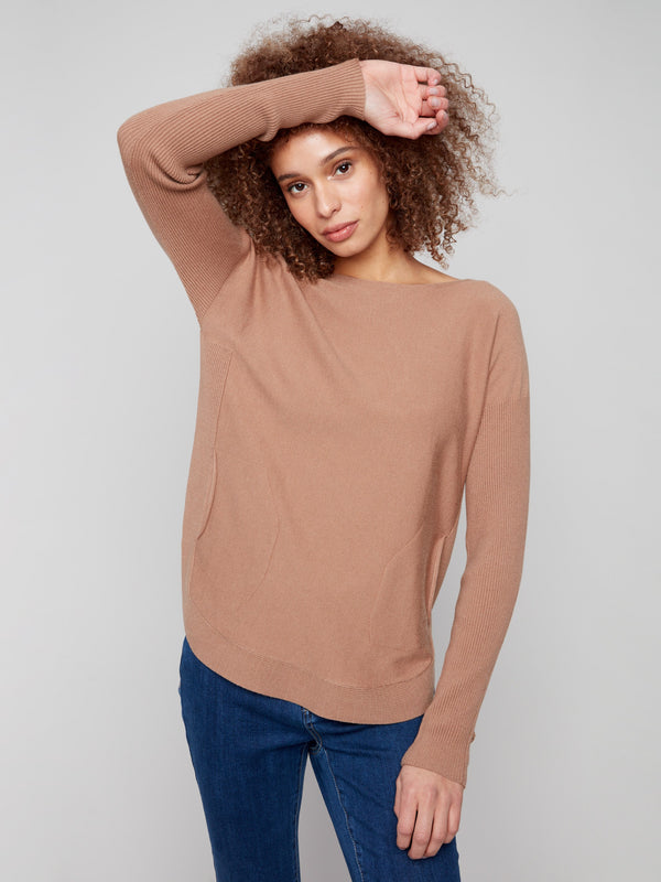 Chic knit sweater showcasing long ribbed sleeves for added warmth and style by Charlie B.