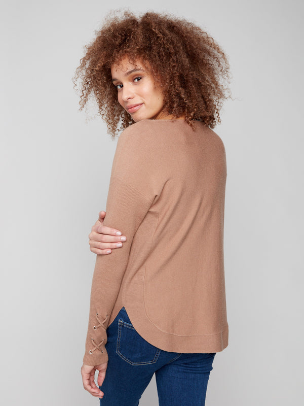 Sophisticated knit sweater with unique cuff lace-up detail for a trendy touch by Charlie B.