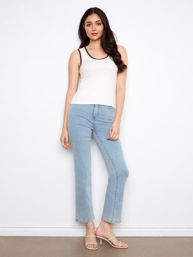 Stylish and comfortable white tank with unique details that make it stand out in any wardrobe. By Charlie B.