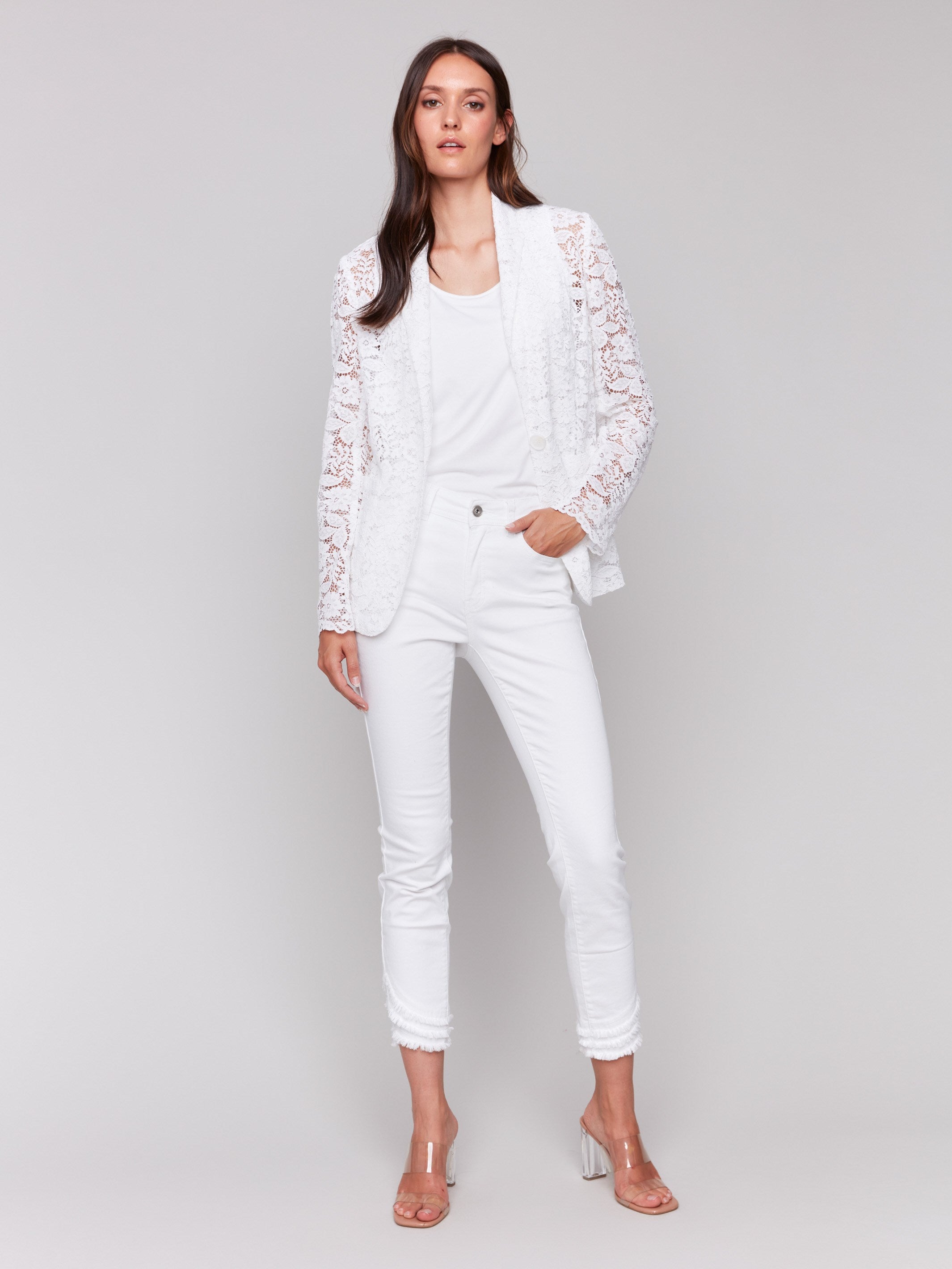 Blazer featuring button closure, crafted in detailed lace by Charlie B.