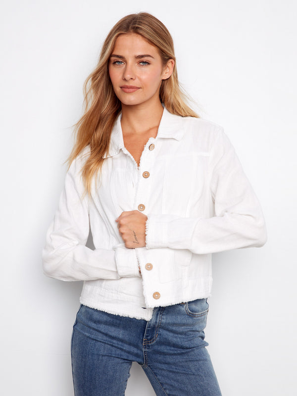 Classic white short-length denim jacket with detailed button closure, perfect for any occasion. By Charlie B.