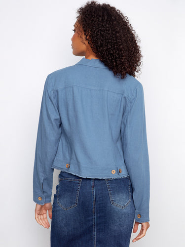 Chic denim skirt paired with the jacket adds to the overall stylish appearance, making it perfect for any occasion. By Charlie B.