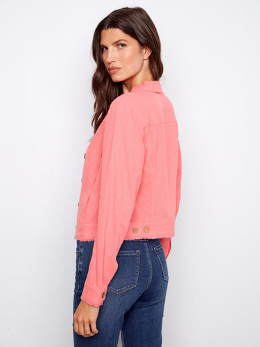 The front button closure on this pink jacket provides a classic style that complements the denim bottoms by Charlie B.