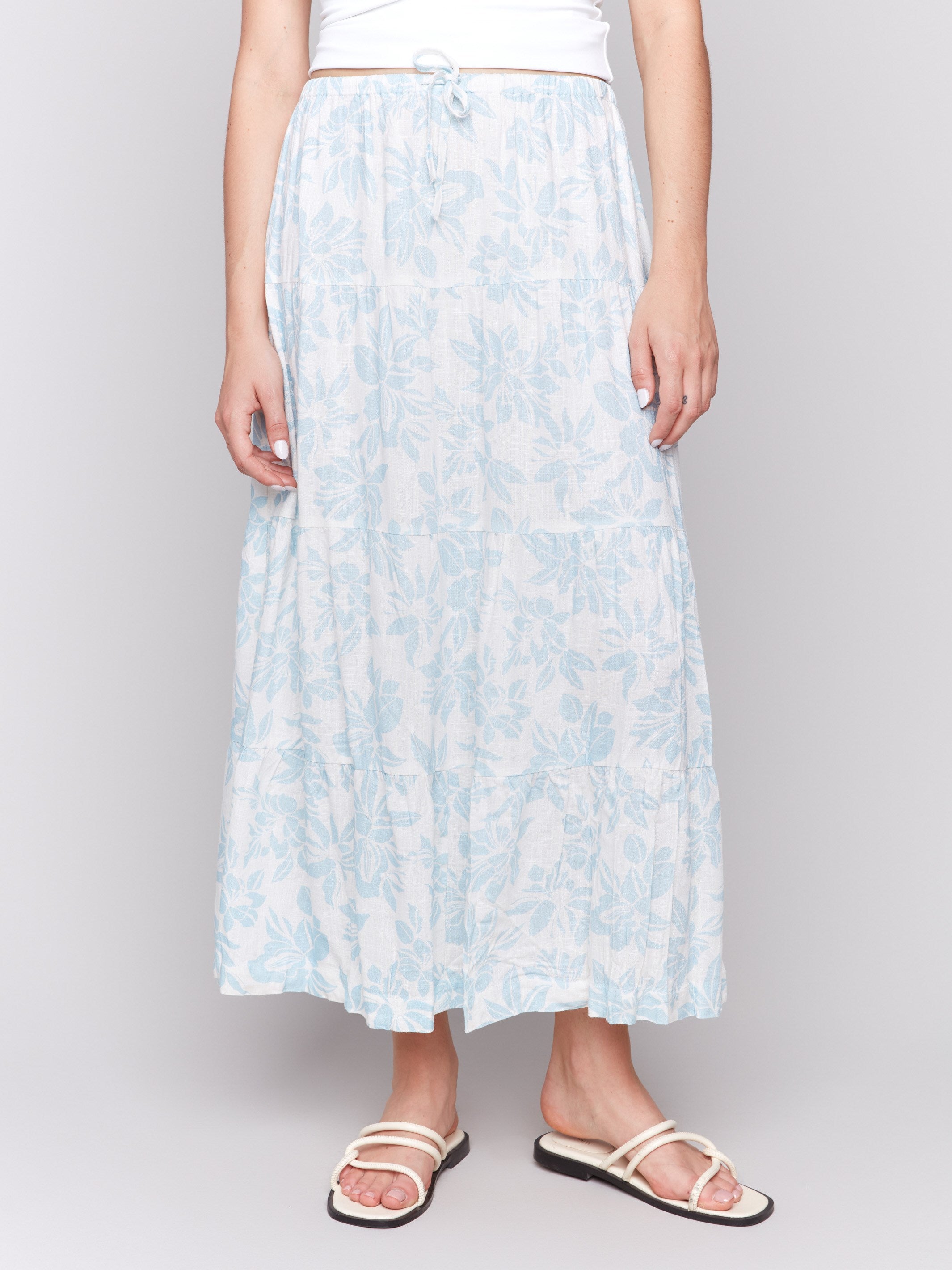 Floral print skirt crafted with an elegant tiered design by Charlie B.