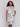Knee-length dress with an abstract pastel pattern and a waist belt by Charlie B.