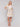 Knee-length dress with pastel abstract pattern and waist belt by Charlie B.