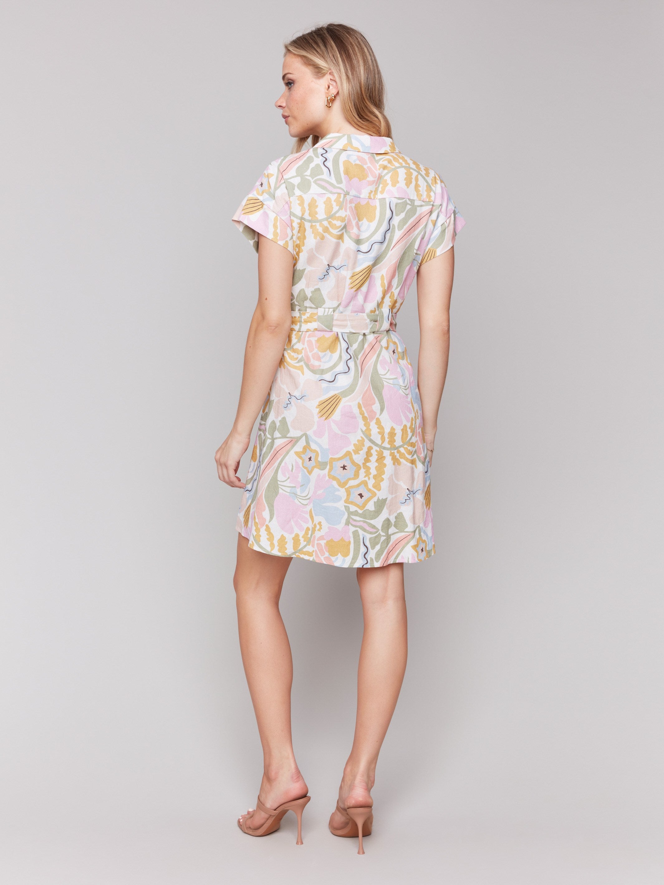 Button-front closure on a knee-length abstract patterned dress by Charlie B.
