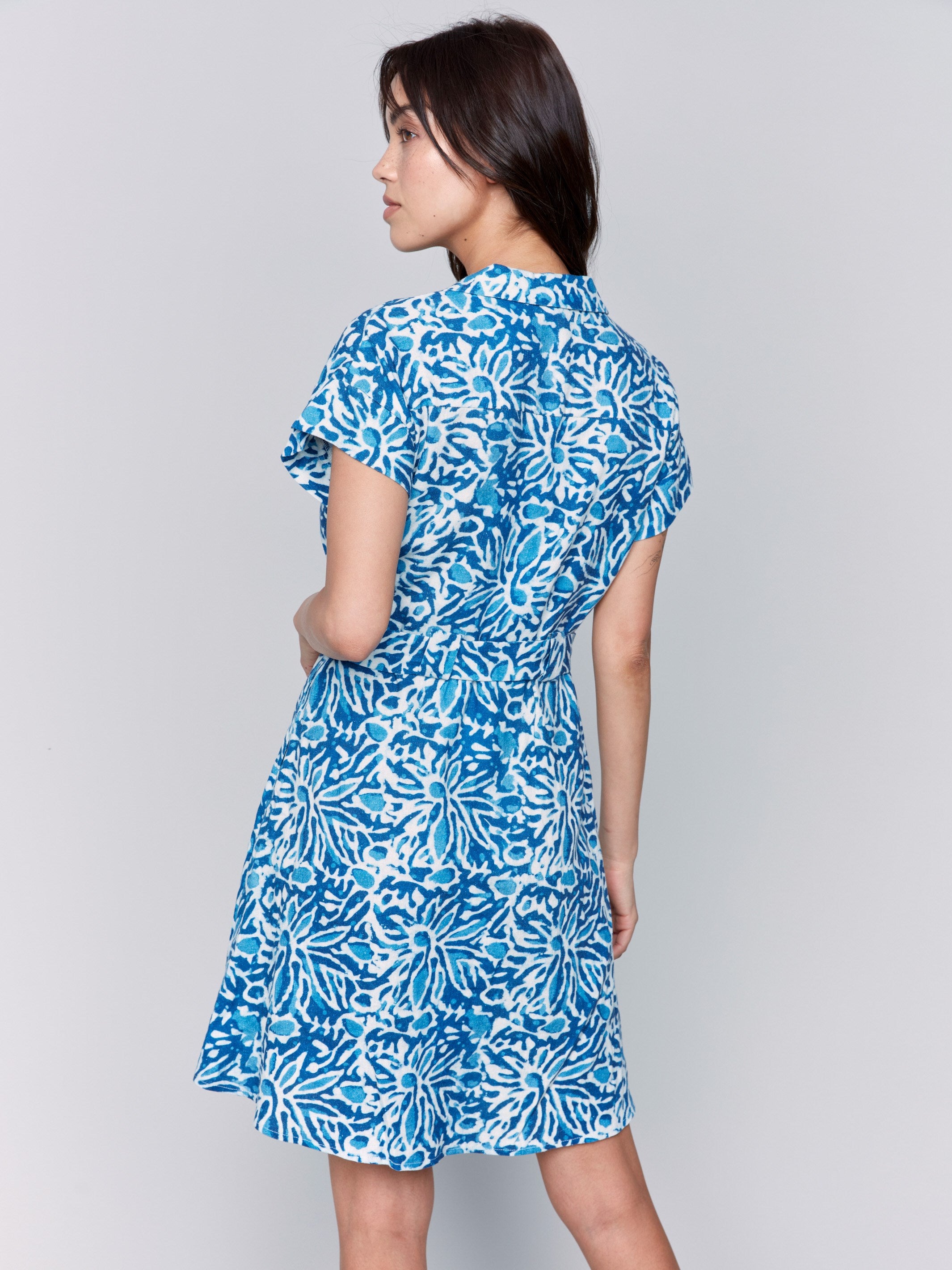 Waist belt accentuates the reef print dress by Charlie B.
