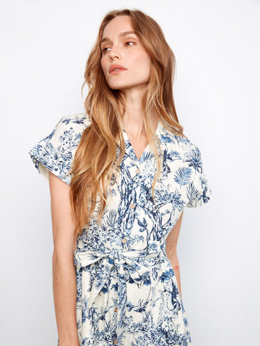 Hidden pockets add functionality to this stylish embroidered blue and white cotton dress by Charlie B.