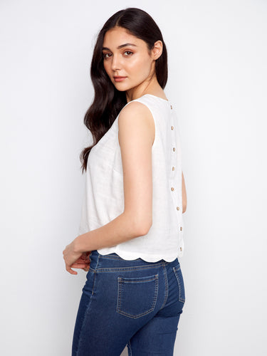 Decorative back buttons add charm to this versatile white top, by Charlie B.