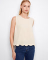 Ivory sleeveless top with a loose fit and scalloped hem, perfect for a casual look by Charlie B.