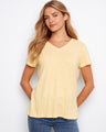 Soft yellow T-shirt with a flattering V-neckline, perfect for casual outings. Designed by Charlie B.