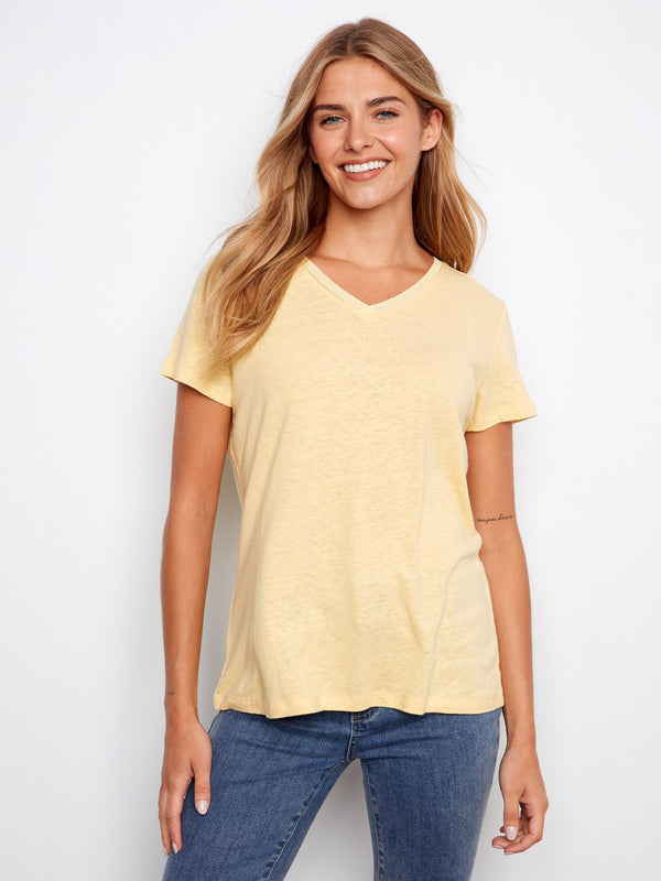 Chic yellow tee featuring short sleeves for a breezy summer look. Crafted by Charlie B.