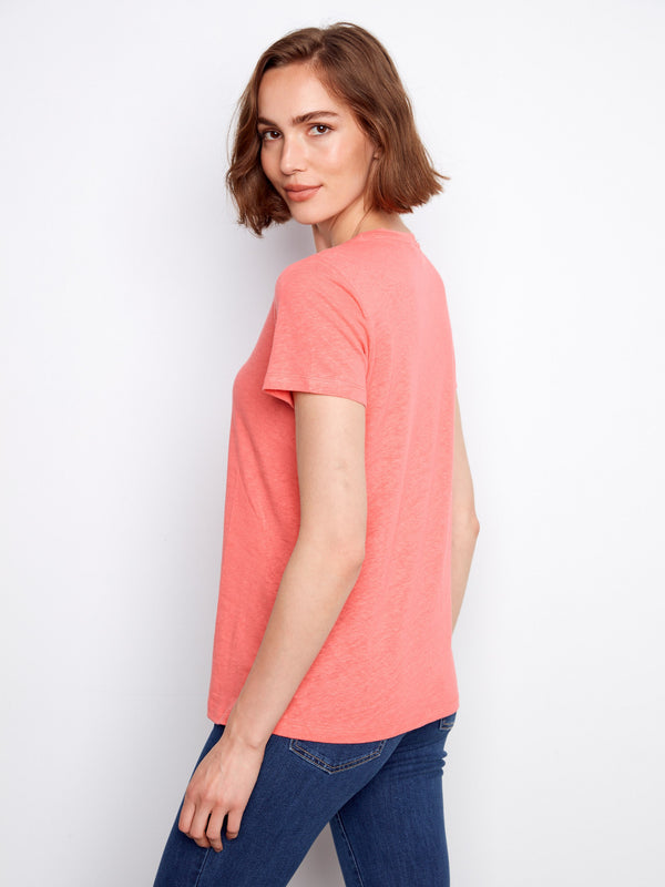 Comfortable coral tee with a flattering V-neck design that adds elegance by Charlie B.