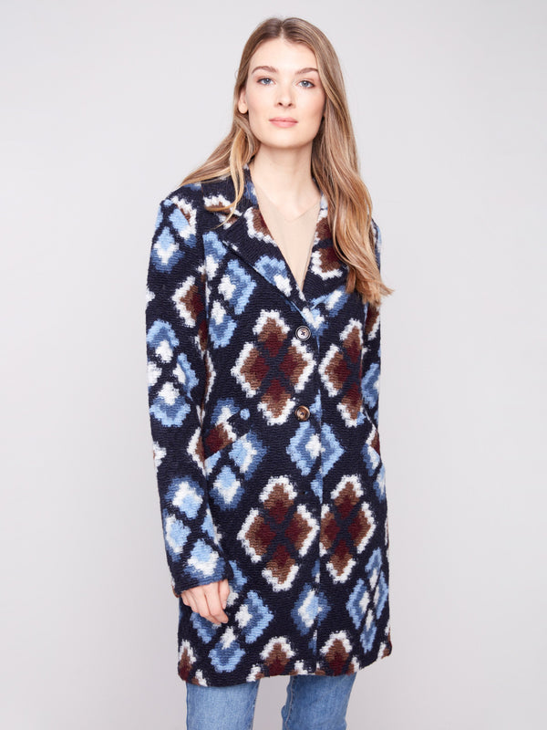 Twilight crochet coat featuring a button closure and intricate geometric design, unlined for added comfort by Charlie B.