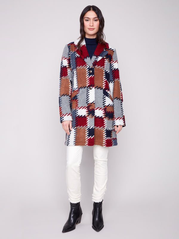 This colorful crochet coat features convenient welt pockets on the front, perfect for keeping essentials close by Charlie B.