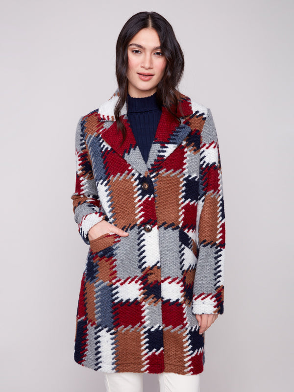 Unlined crochet coat in a striking plaid pattern, designed with button closure for easy wear and versatility by Charlie B.