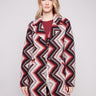 Crochet coat in primrose with a geometric pattern, featuring a tailored collar for a refined look by Charlie B.