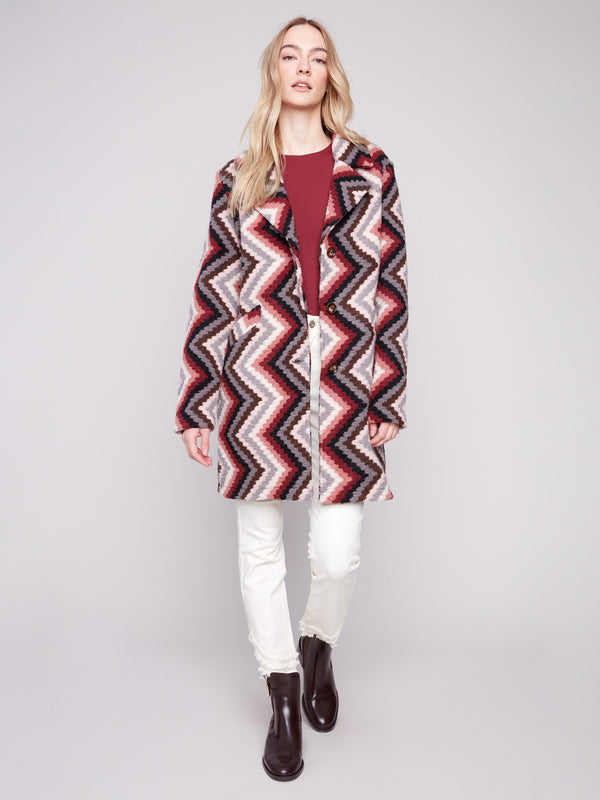 Primrose crochet coat with geometric design, complete with convenient welt pockets on the front by Charlie B.