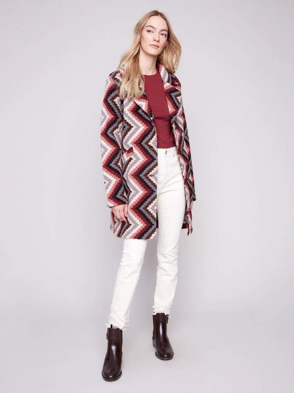 Elegant crochet coat in primrose, showcasing an unlined interior for lightweight comfort by Charlie B.