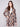 This unlined crochet coat in sepia features a bold geometric pattern and tailored collar by Charlie B.
