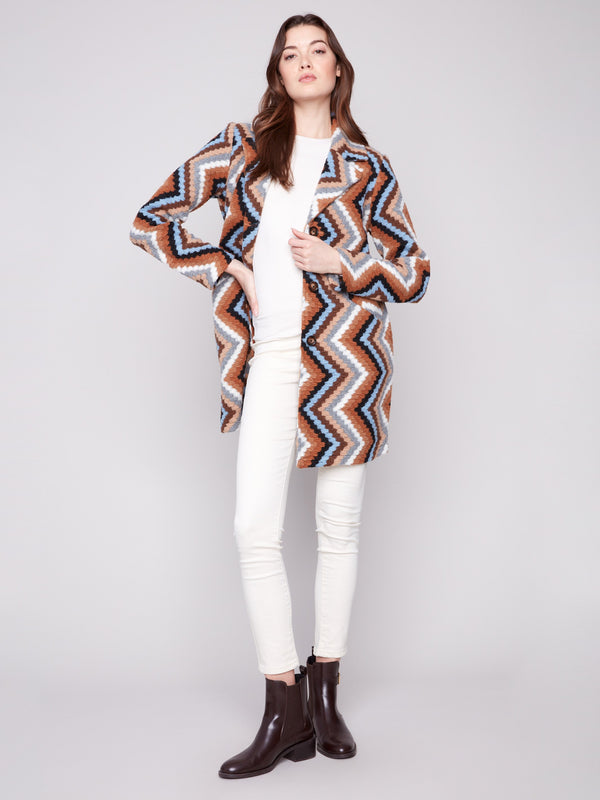 Unlined design adds comfort to this sepia crochet coat with striking geometric pattern by Charlie B.
