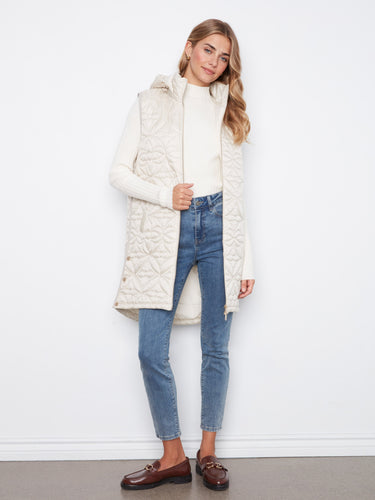 A zip-front closure defines this chic quilted vest, offering both functionality and fashion-forward style by Charlie B.