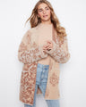 This stylish cardigan features wide sleeves, adding a touch of elegance to any outfit. Perfect for layering in cooler weather by Charlie B.