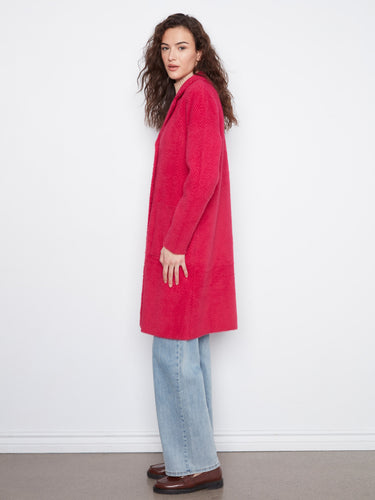 This longline silhouette coat enhances your style with its sophisticated design and impeccable tailoring by Charlie B.