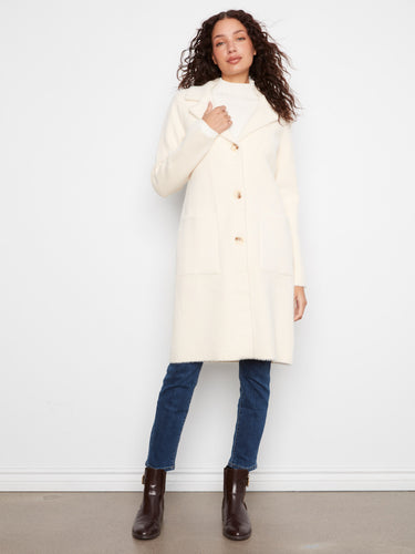 Cream coat with elegant button closure, offering a refined look by Charlie B.