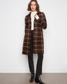 Brown plaid coat with a notched collar and front button closure, offering a stylish touch to any outfit by Charlie B.