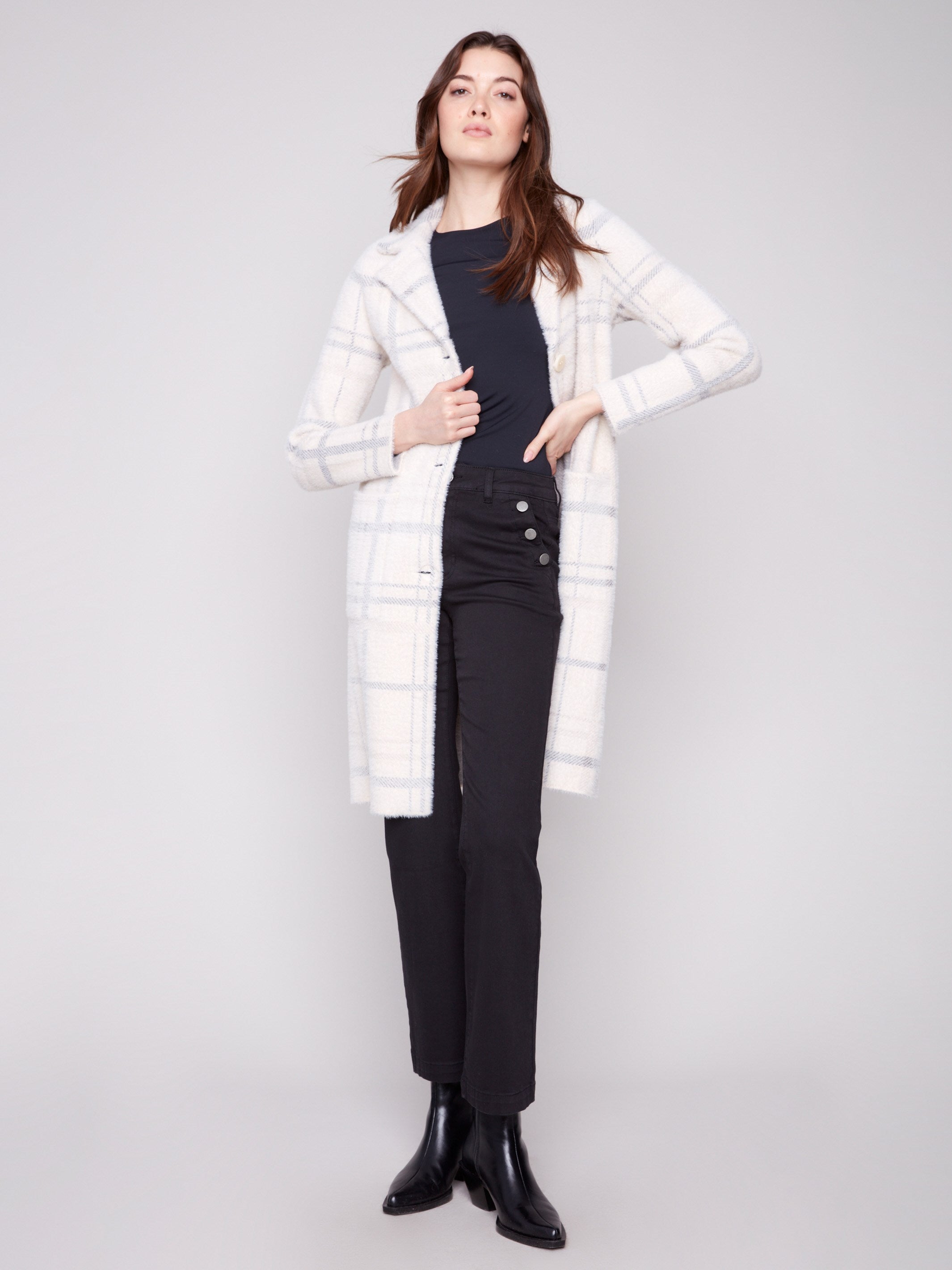 Elegant ivory coatigan with two practical side pockets, enhancing its functional design by Charlie B.