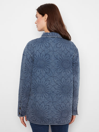 Stylish medium blue quilted denim jacket showcasing a unique floral design and shirt collar detail. By Charlie B.