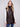 Quilted faux leather vest in mocha with convenient welt pockets and stylish snap button front by Charlie B.