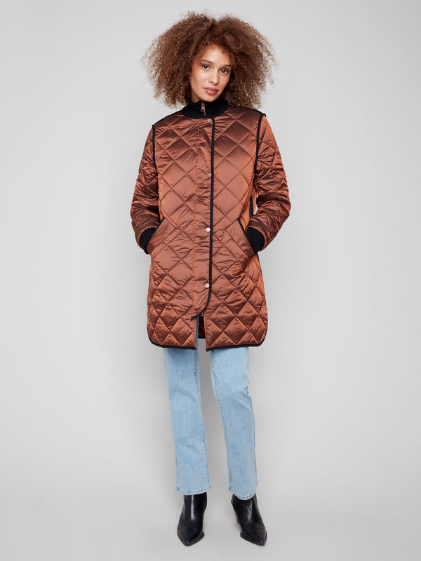 Sepia quilted puffer jacket featuring a zipper front with snap buttons, adding style and function by Charlie B.
