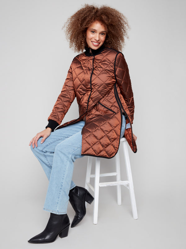 Stylish sepia jacket showcasing side zipper details for added versatility by Charlie B.