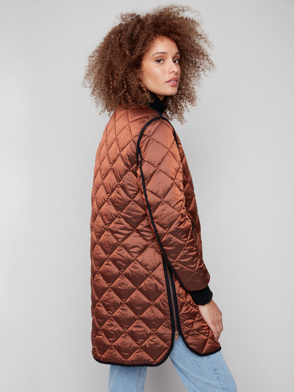 Quilted design in a sepia tone, highlighting the rib knit detailing on this chic puffer jacket by Charlie B.