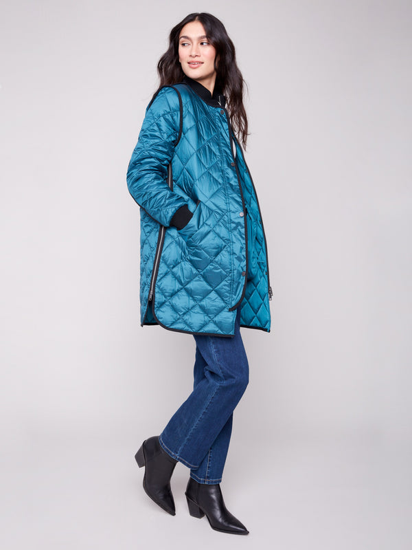 Elegant evergreen puffer jacket showcasing a classic quilted design by Charlie B.