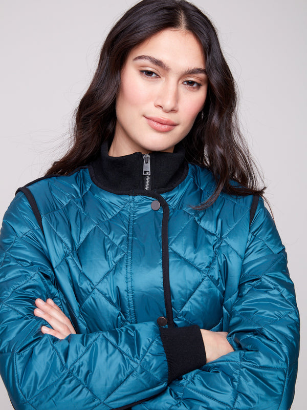 Chic evergreen quilted puffer with two front welt pockets for convenience by Charlie B.