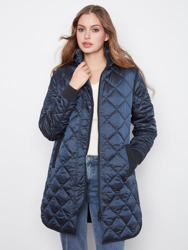 Stylish coat featuring welt pockets for added functionality and flair by Charlie B.