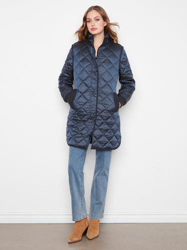 Quilted coat with front zip closure and snap buttons for secure warmth by Charlie B.