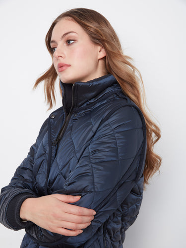 Chic coat showcasing a removable hood, offering versatility in style by Charlie B.