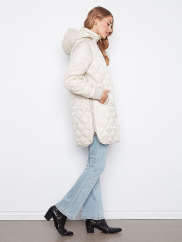 Stylish quilted coat showcasing ribbed knit details that add texture and flair to your look. Crafted with care by Charlie B.