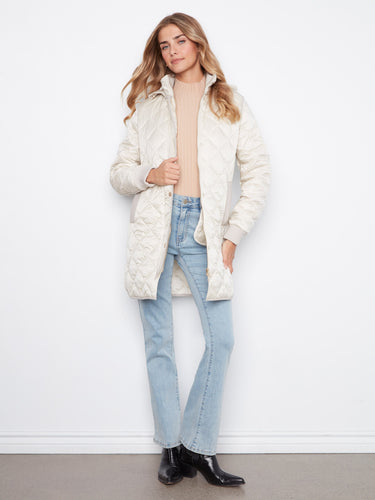 Classic quilted coat offering both warmth and style, designed to keep you cozy in cooler weather. A wardrobe staple by Charlie B.