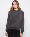 Charcoal top featuring a ribbed neck, hem and cuffs, adding texture and style by Charlie B.